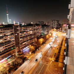 Concrete building and night traffic of Leipziger Straße