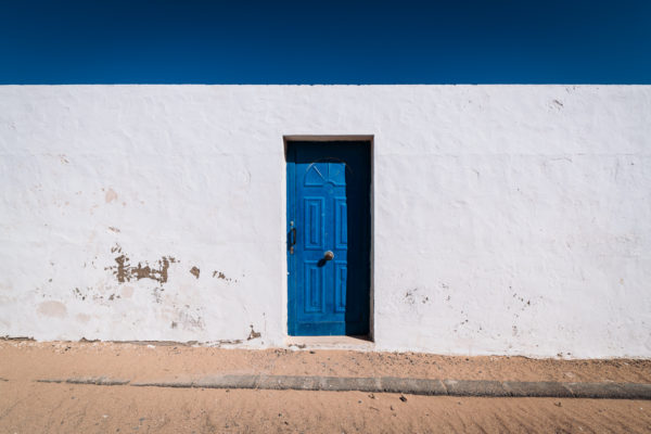 Entrance of a typically blue-white coloured house on Canary Islands